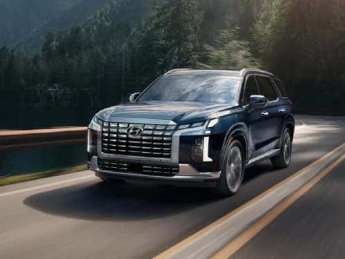 2025 Hyundai PALISADE driving fast on a road