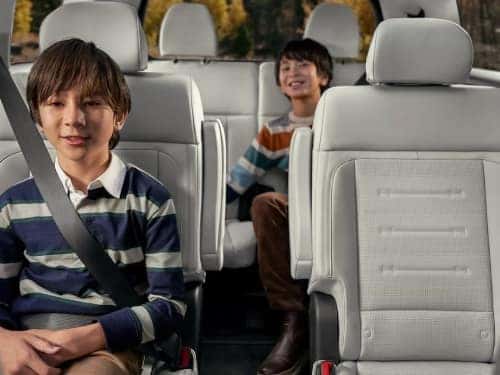 2025 Hyundai SANTA FE Hybrid view of children sitting in middle and back seats