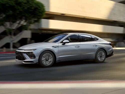 2025 Hyundai SONATA Hybrid driving fast through a city