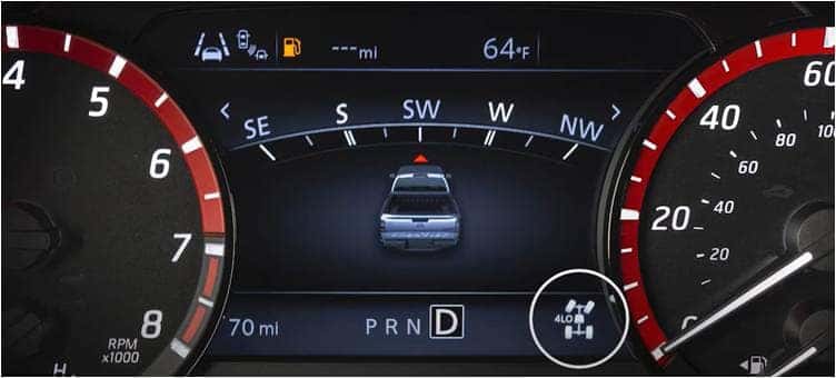 Screen on a Nissan Frontier showing that the truck is in four-wheel low drive.