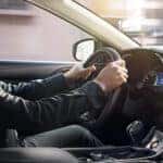 A person driving a car.