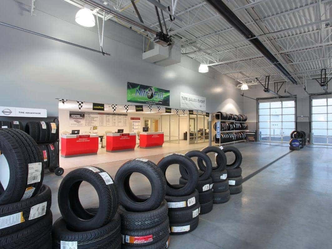 A large room with tires stacked in rows