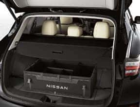 The trunk of a car with a storage box