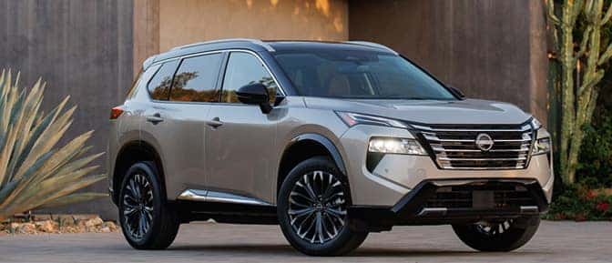 A silver suv parked in front of a building