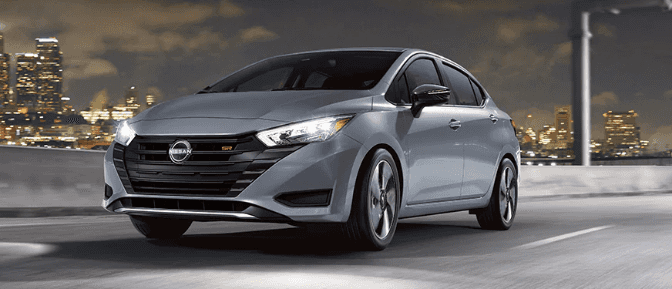 A gray car driving on a highway