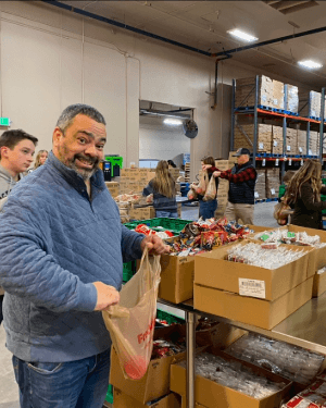 A person holding a bag in a warehouse