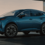 A blue car parked in front of a building