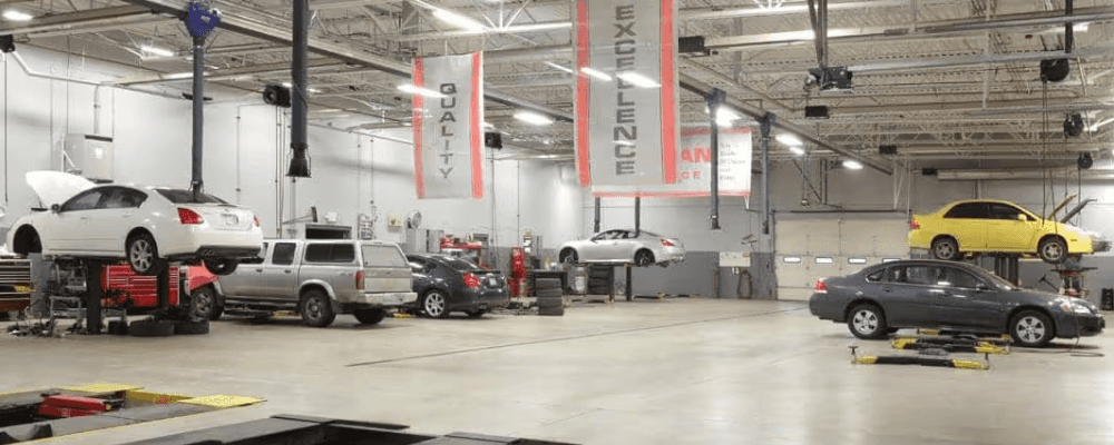 A car service room with banners from ceiling
