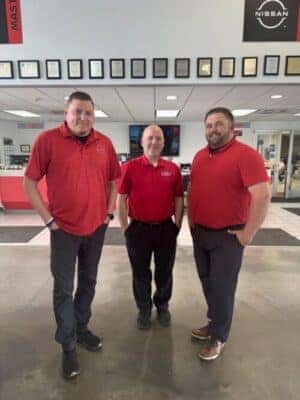 A group of men in red shirts