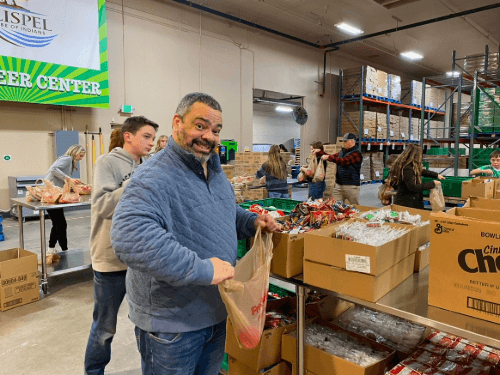 A person holding a bag in a warehouse