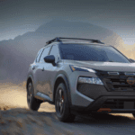 A car driving on a dirt road.