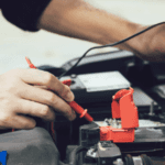 A person holding a cable