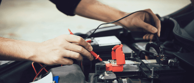 A person holding a cable