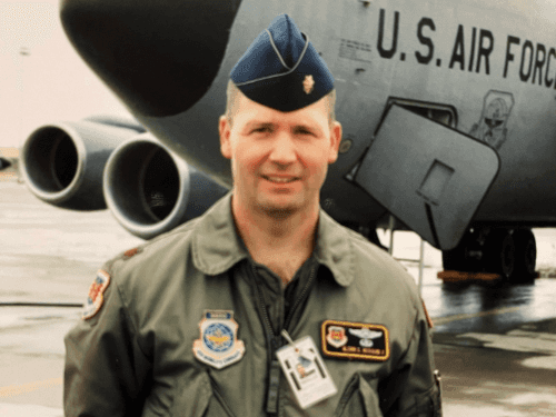 A U.S. Air Force veteran, wearing a flight suit large military aircraft.