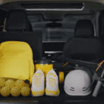 The cargo area of a 2025 Nissan Kicks with a bag and sports equipment