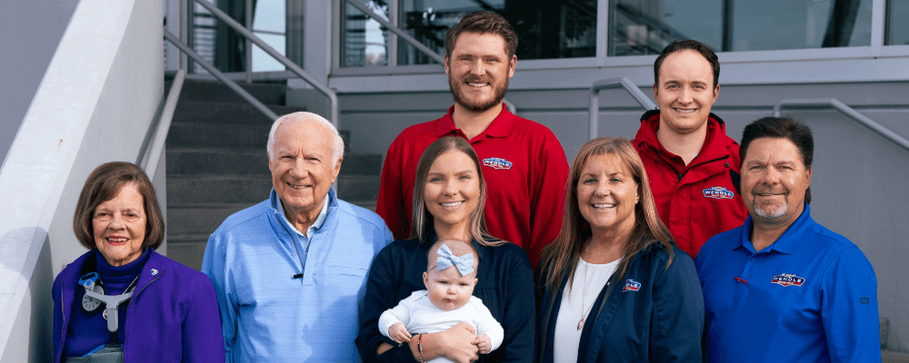 A group portrait of the Wendle family representing Wendle Nissan in Spokane WA.