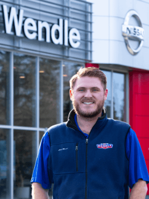 Man standing in front of Wendle Nissan dealership