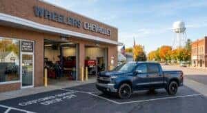Customer dropping off a Chevrolet truck at the Wheelers Family Auto service center for brake inspection and repair