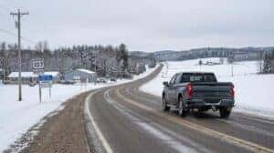 Chevrolet Silverado on Wisconsin state highway between Schofield and Merrill approaching service center for brake repair