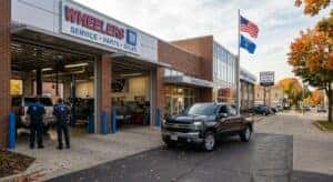 Chevrolet truck pulling into a Wisconsin dealership service drive for an oil change appointment in Lincoln County