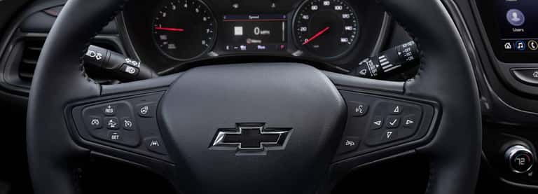 Interior photo of Chevrolet dashboard with wheel and accessories